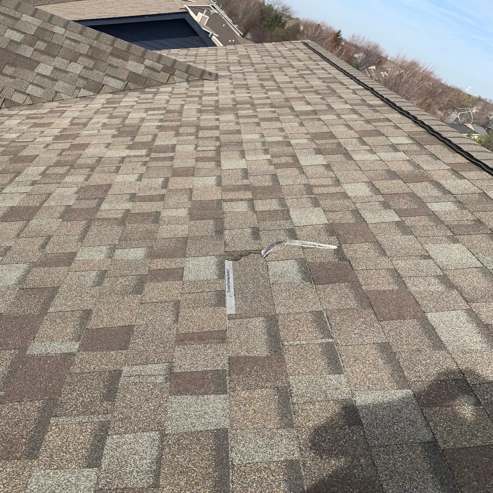 torn asphalt shingle in Waukee